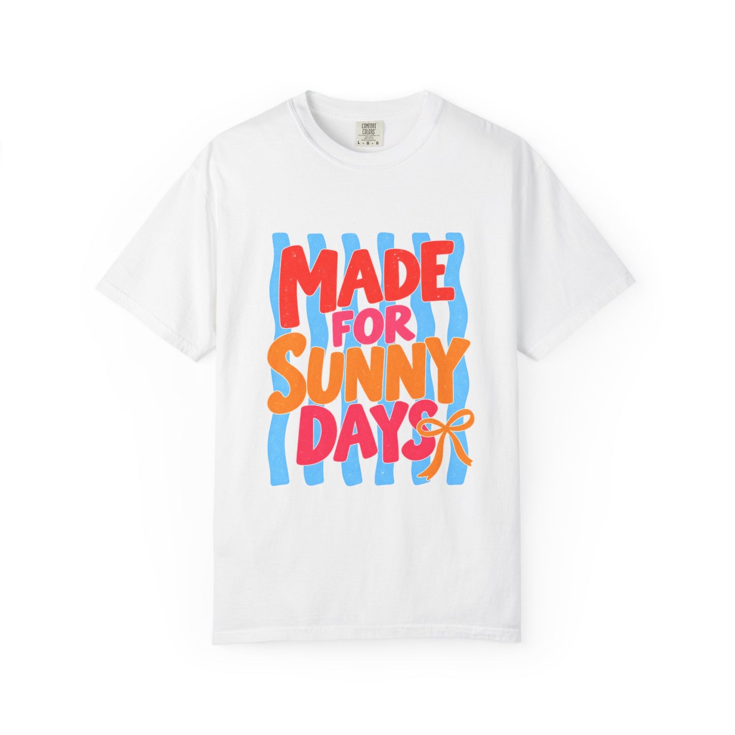 Made for Sunny Days Tee in White, front view - a large centered full-front print in chunky red and orange lettering over a wavy stripe backing, on a garment-dyed Comfort Colors 1717 tee.