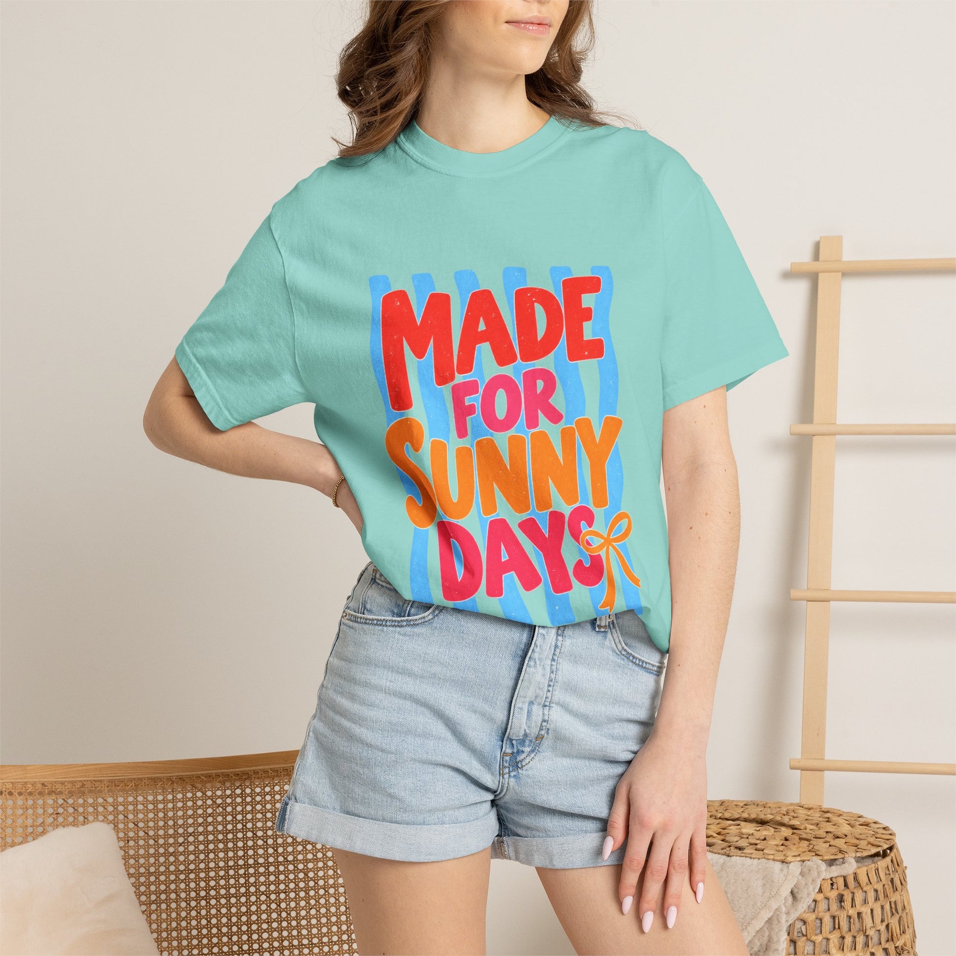 Made for Sunny Days Tee in Chalky Mint, front view - a large centered full-front print in chunky red and orange lettering over a wavy stripe backing, on a garment-dyed Comfort Colors 1717 tee.