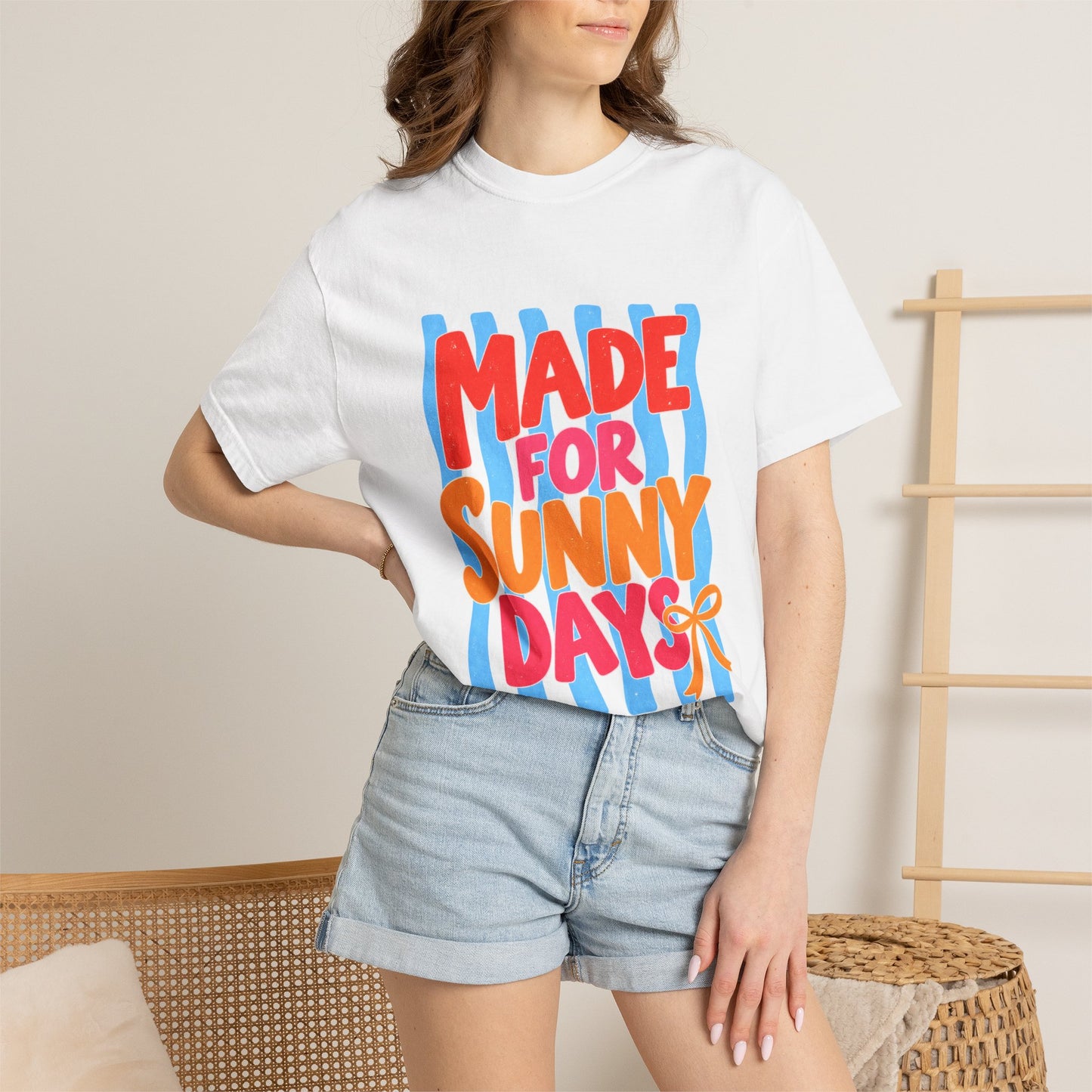 Made for Sunny Days Tee in Ivory, front view - a large centered full-front print in chunky red and orange lettering over a wavy stripe backing, on a garment-dyed Comfort Colors 1717 tee.