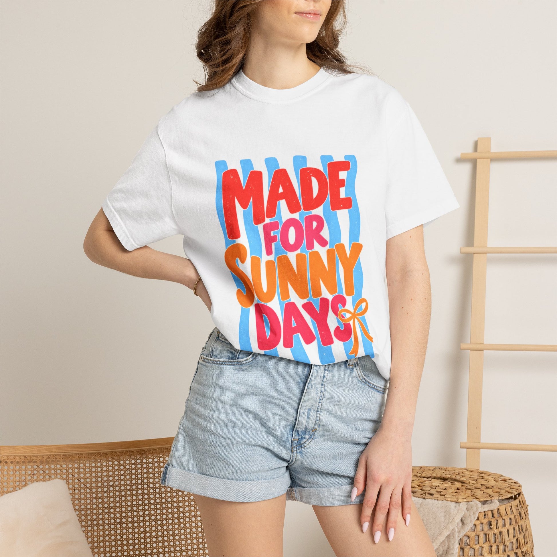 Made for Sunny Days Tee in Ivory, front view - a large centered full-front print in chunky red and orange lettering over a wavy stripe backing, on a garment-dyed Comfort Colors 1717 tee.