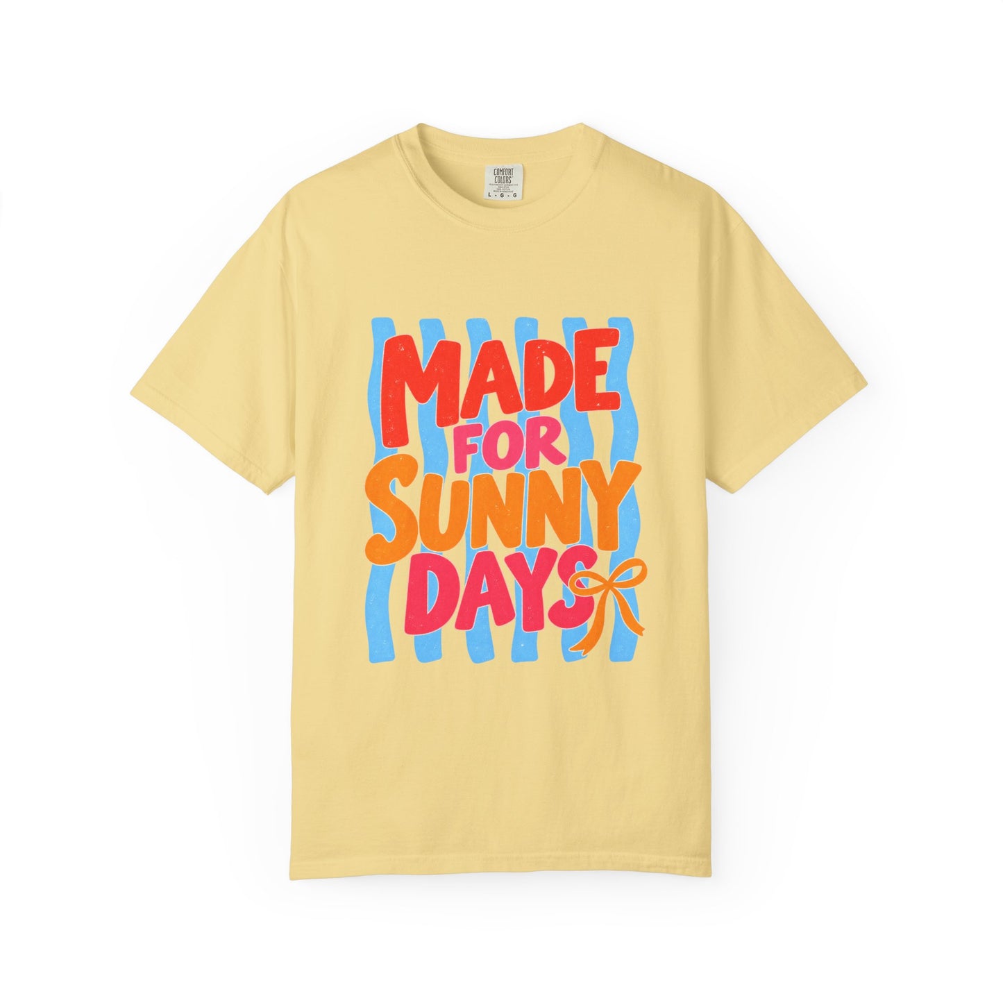 Made for Sunny Days Tee in White, front view - a large centered full-front print in chunky red and orange lettering over a wavy stripe backing, on a garment-dyed Comfort Colors 1717 tee.