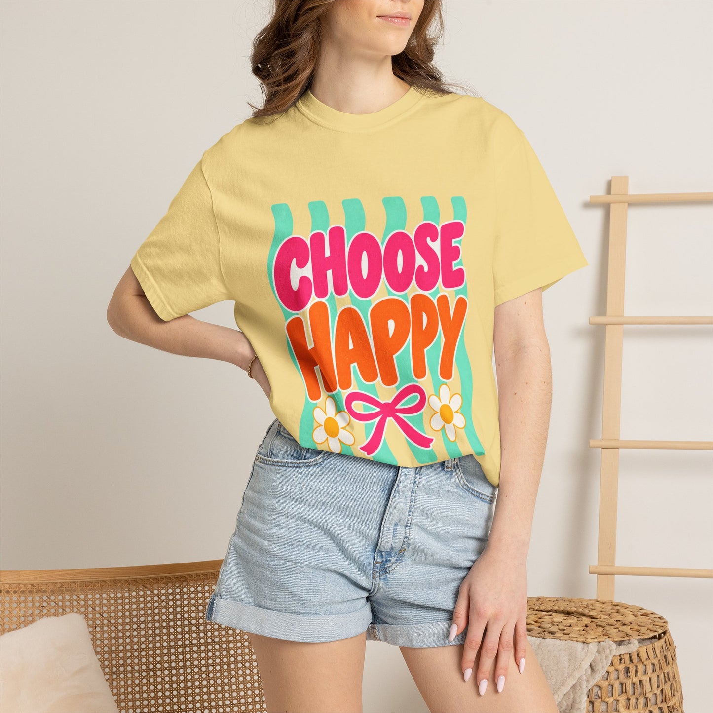 Choose Happy Tee in Butter, front view - a large centered full-front print in rounded pink and orange lettering with daisies, on a garment-dyed Comfort Colors 1717 tee.