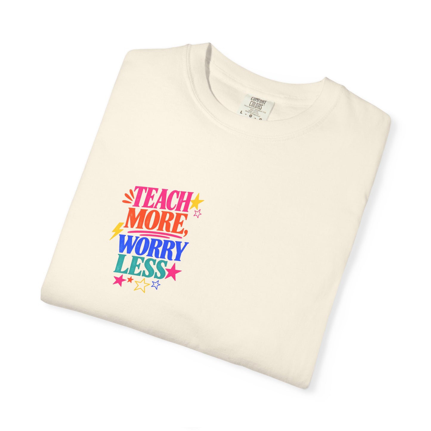 Teach More, Worry Less Tee in Ivory, folded flat - a small left-chest print on a garment-dyed Comfort Colors 1717 tee.
