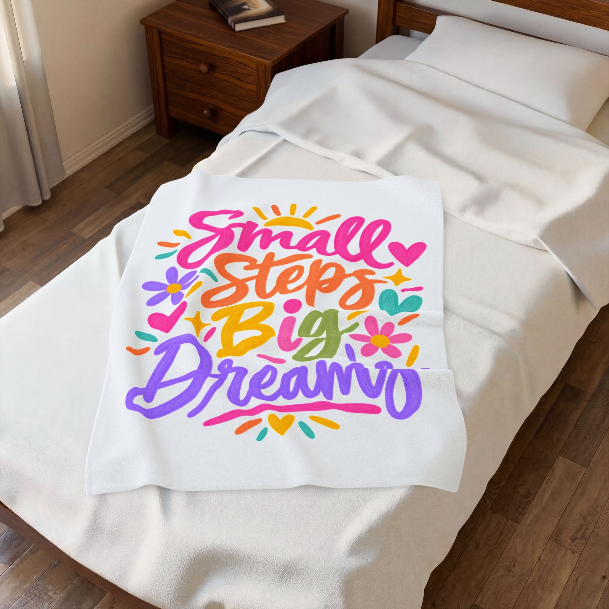 Small Steps, Big Dreams velveteen plush blanket with a bright hand-lettered print.