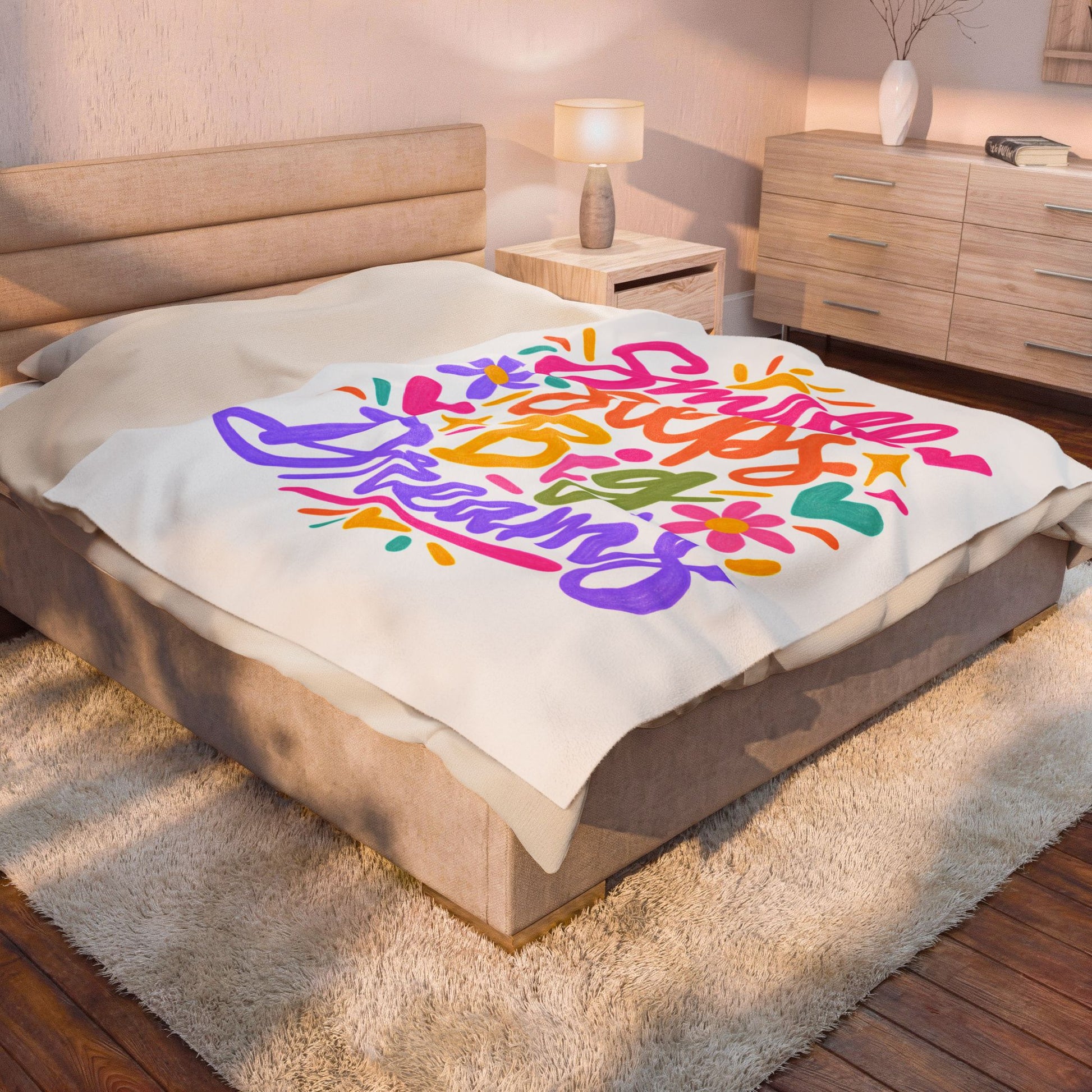 Small Steps, Big Dreams velveteen plush blanket with a bright hand-lettered print.