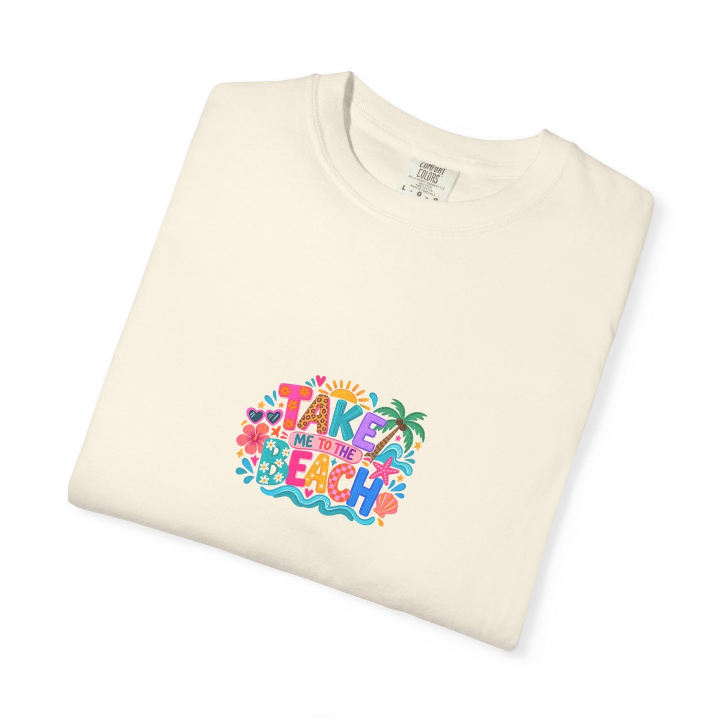 Take Me To The Beach Tee in Ivory, folded flat - a centred upper-front print on a garment-dyed Comfort Colors 1717 tee.