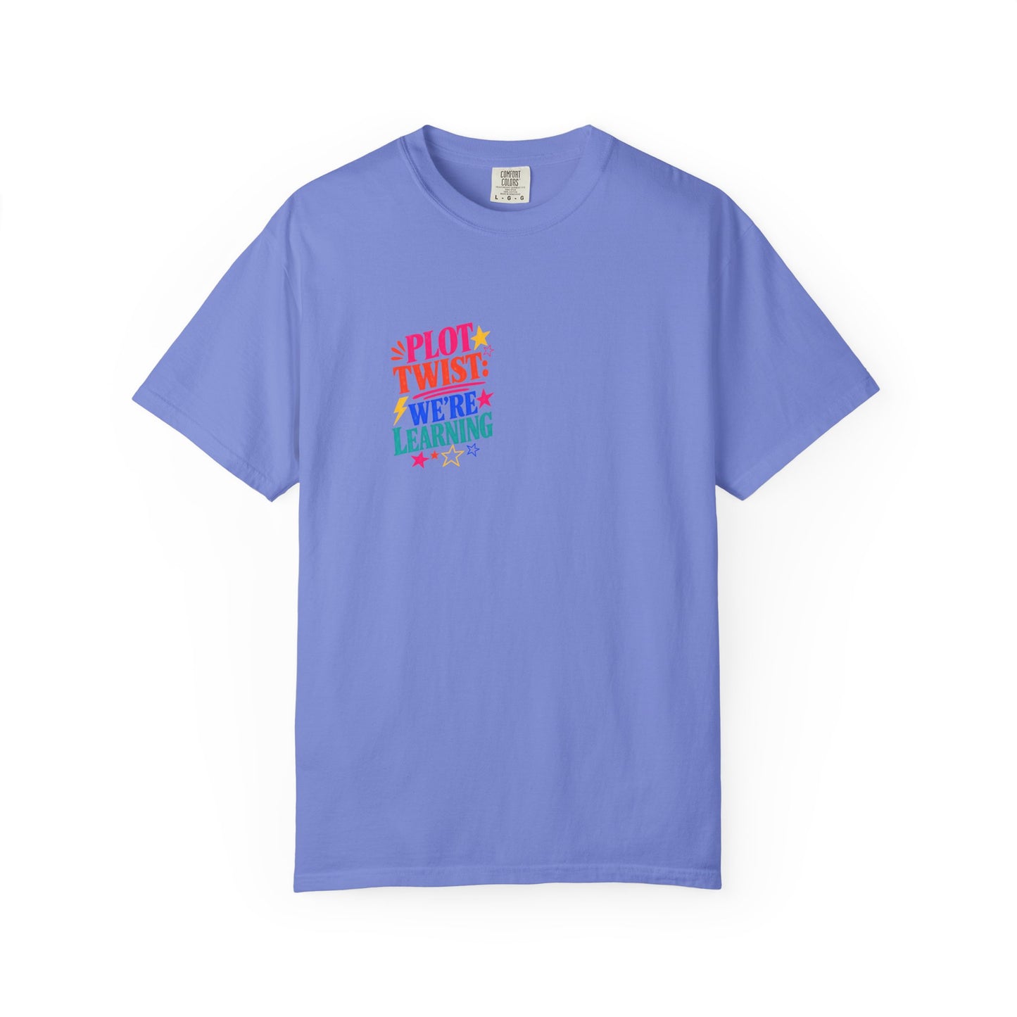 Plot Twist: We're Learning Tee in Flo Blue, front view - a small left-chest print on a garment-dyed Comfort Colors 1717 tee.