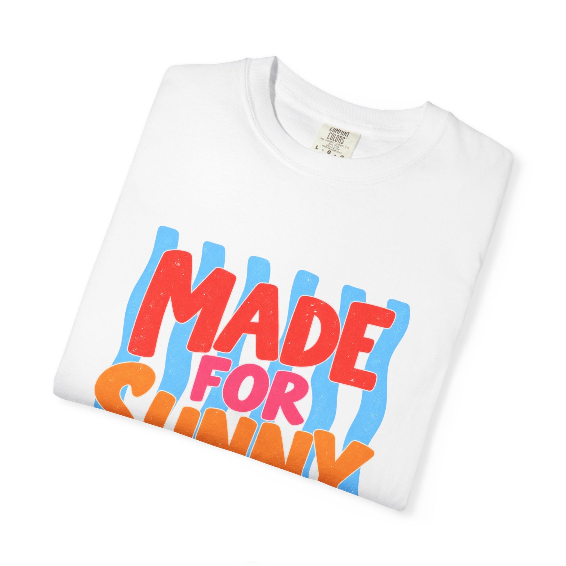 Made for Sunny Days Tee in Ivory, front view - a large centered full-front print in chunky red and orange lettering over a wavy stripe backing, on a garment-dyed Comfort Colors 1717 tee.