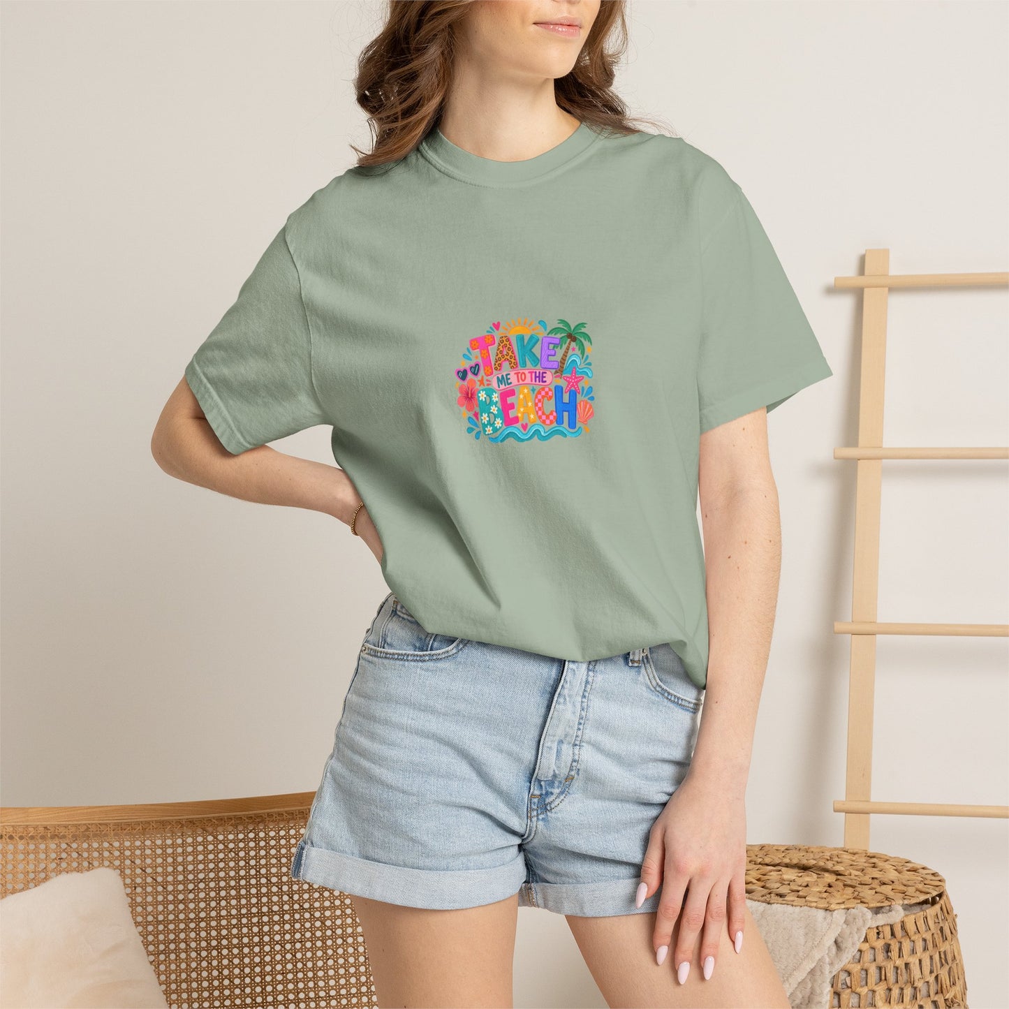Take Me To The Beach Tee in Bay, worn by a model - a centred upper-front print on a garment-dyed Comfort Colors 1717 tee.