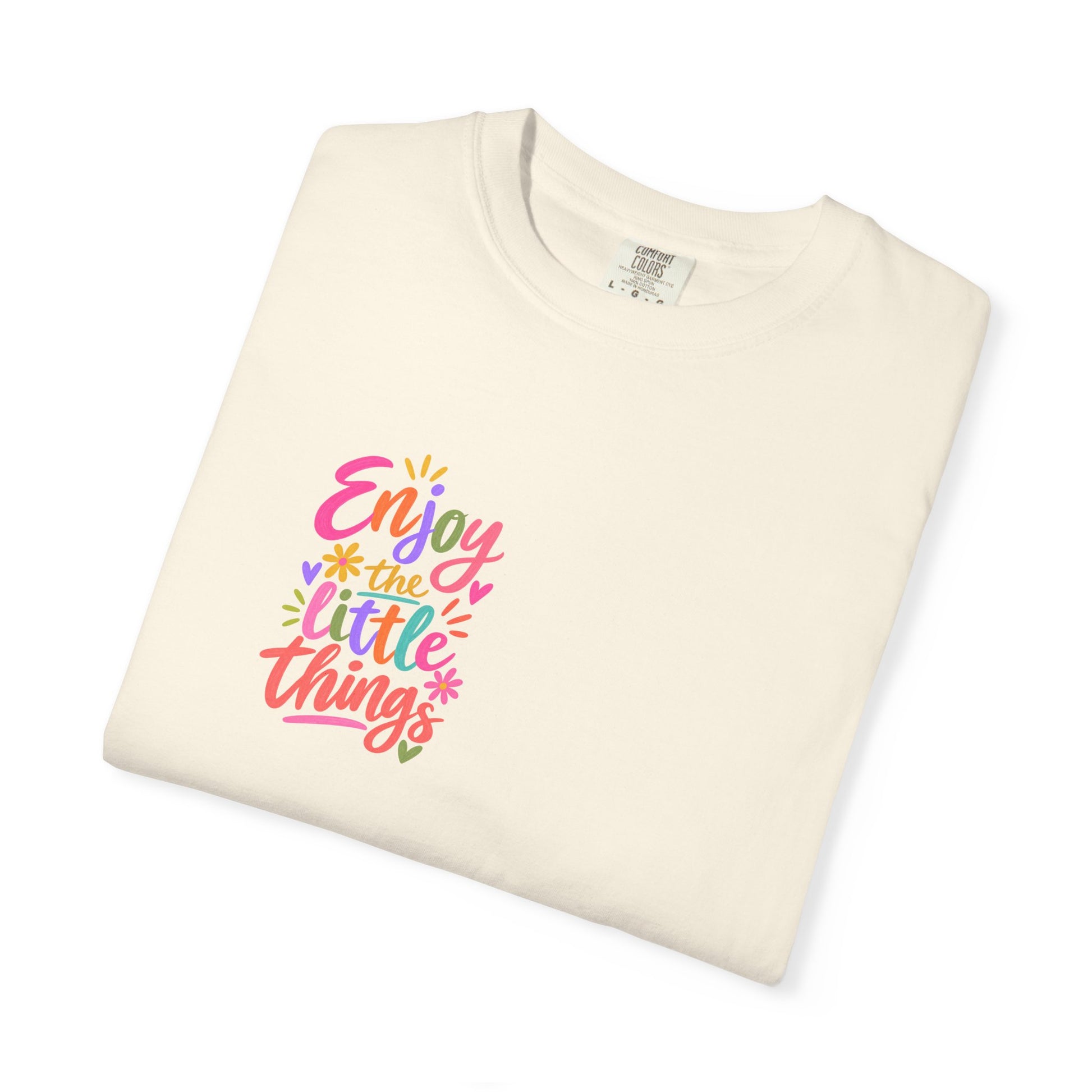 Enjoy the Little Things Tee in Ivory, folded flat - a small left-chest brush-script print on a garment-dyed Comfort Colors 1717 tee.