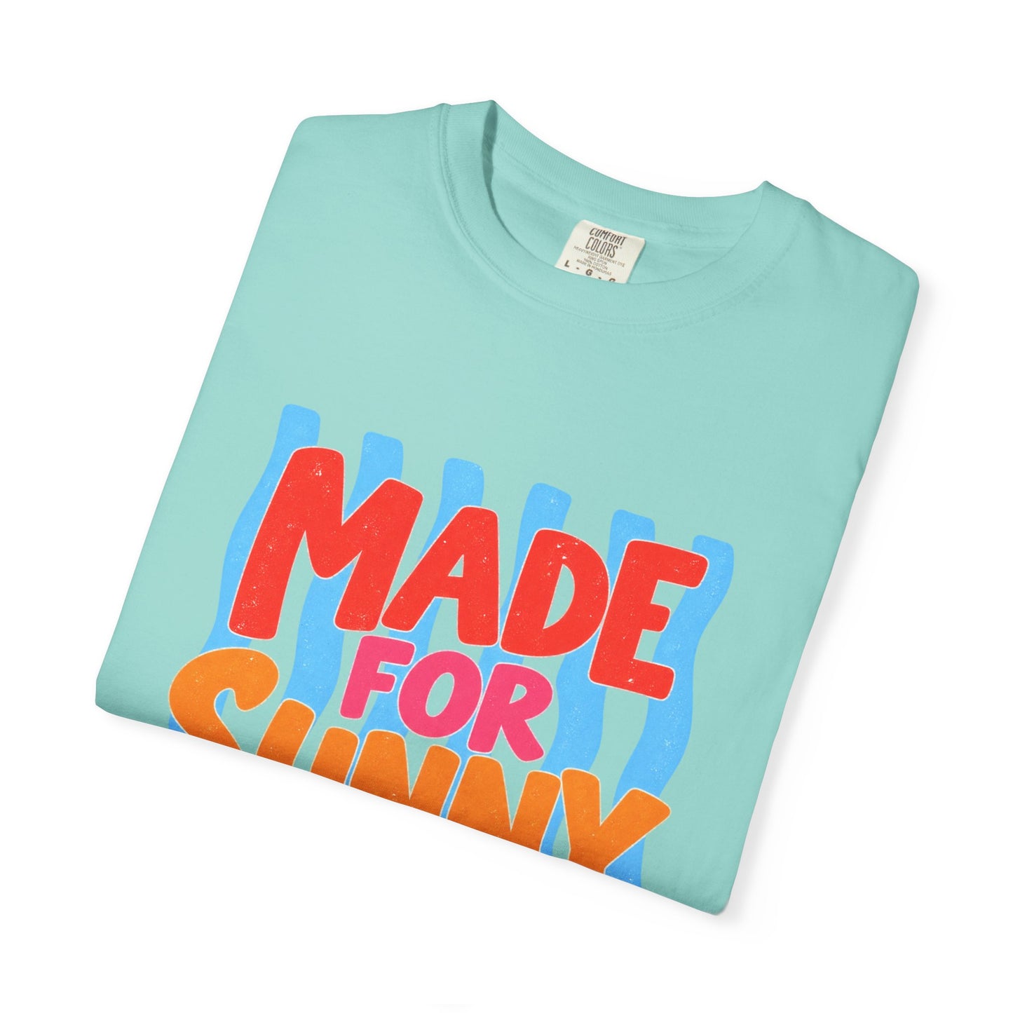 Made for Sunny Days Tee in Chalky Mint, front view - a large centered full-front print in chunky red and orange lettering over a wavy stripe backing, on a garment-dyed Comfort Colors 1717 tee.