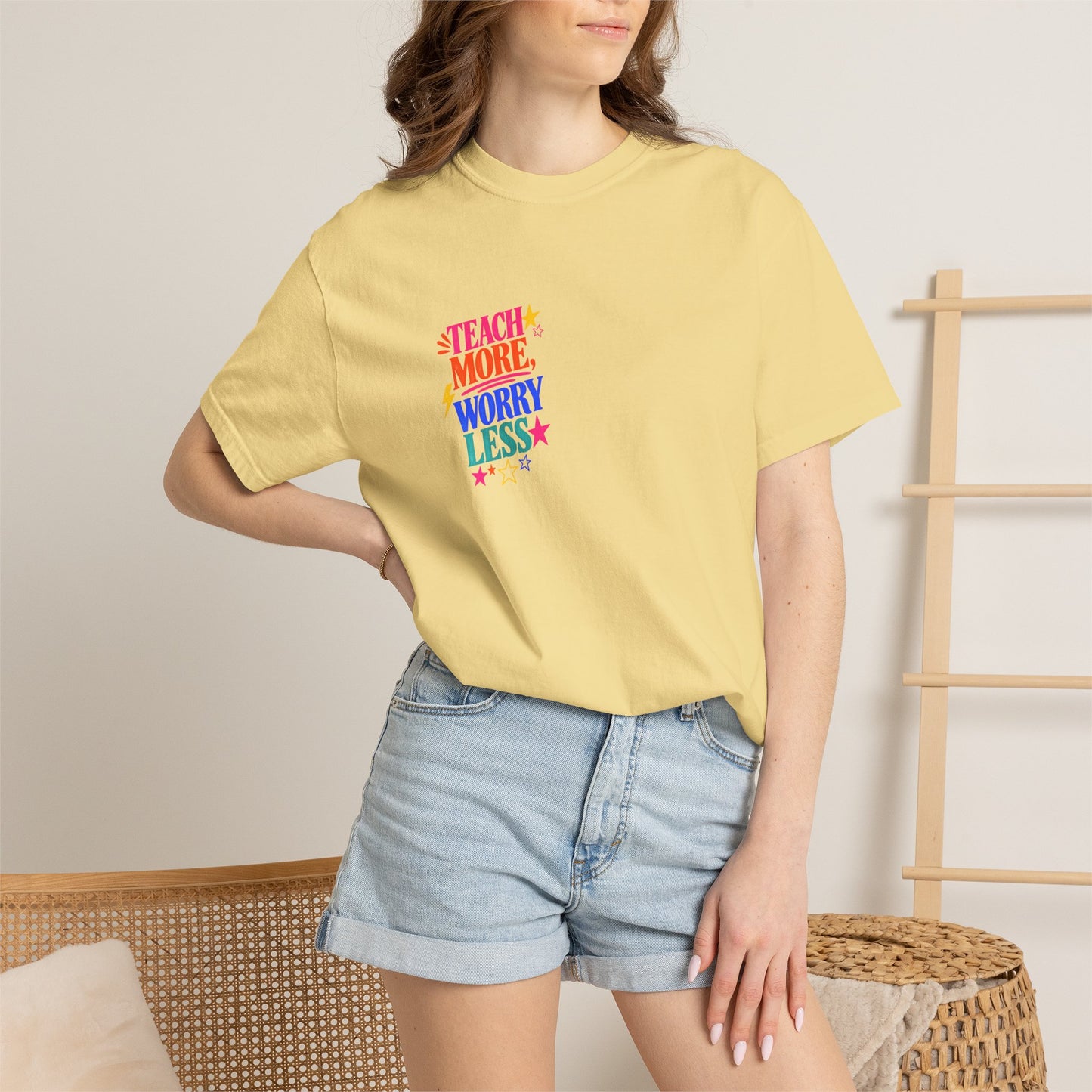 Teach More, Worry Less Tee in Butter, worn by a model - a small left-chest print on a garment-dyed Comfort Colors 1717 tee.