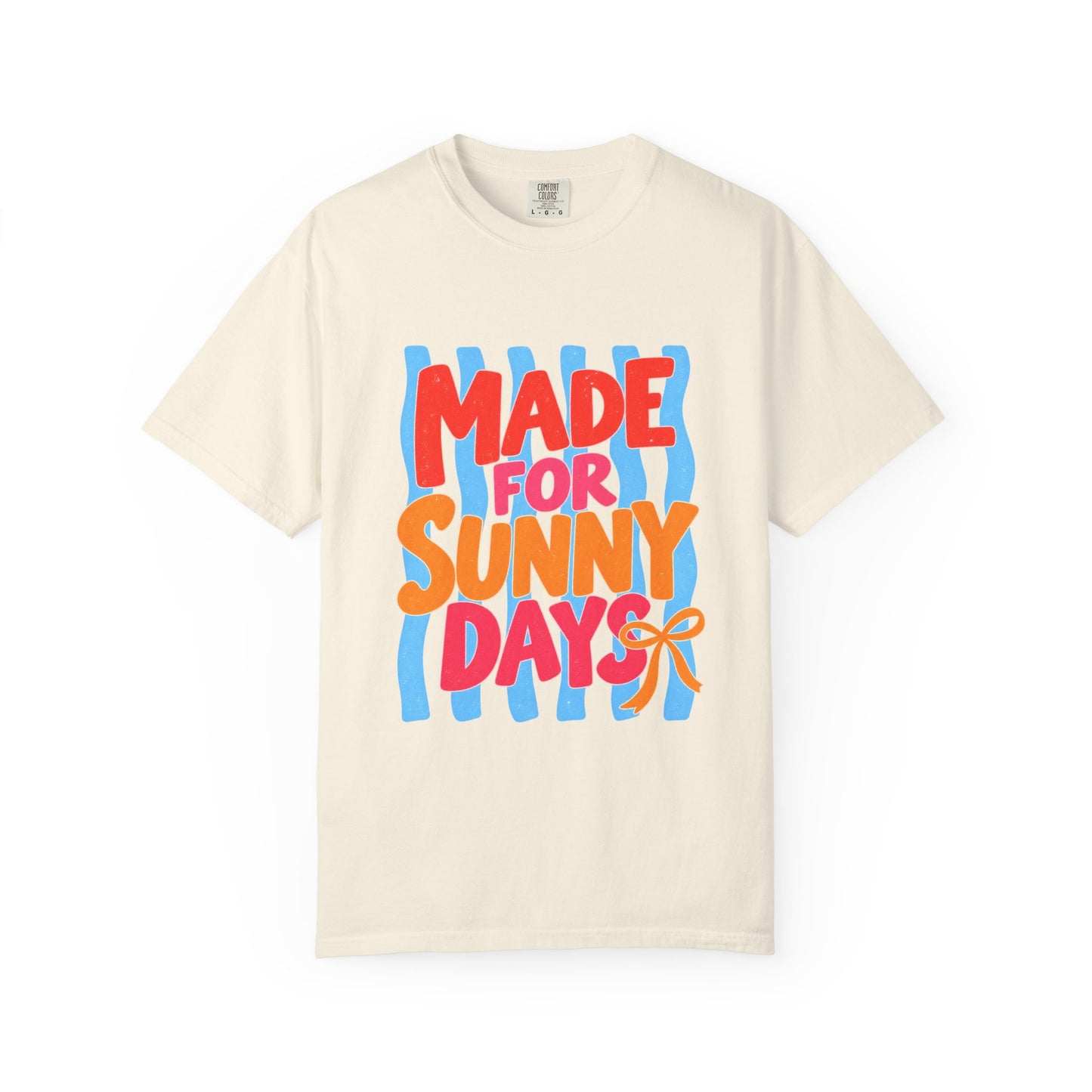 Made for Sunny Days Tee in White, front view - a large centered full-front print in chunky red and orange lettering over a wavy stripe backing, on a garment-dyed Comfort Colors 1717 tee.