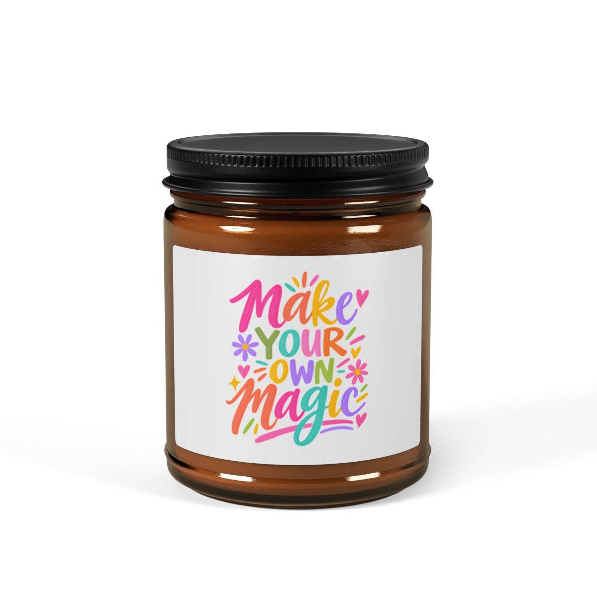Make Your Own Magic soy candle in an amber glass jar with a bright hand-lettered label, front view