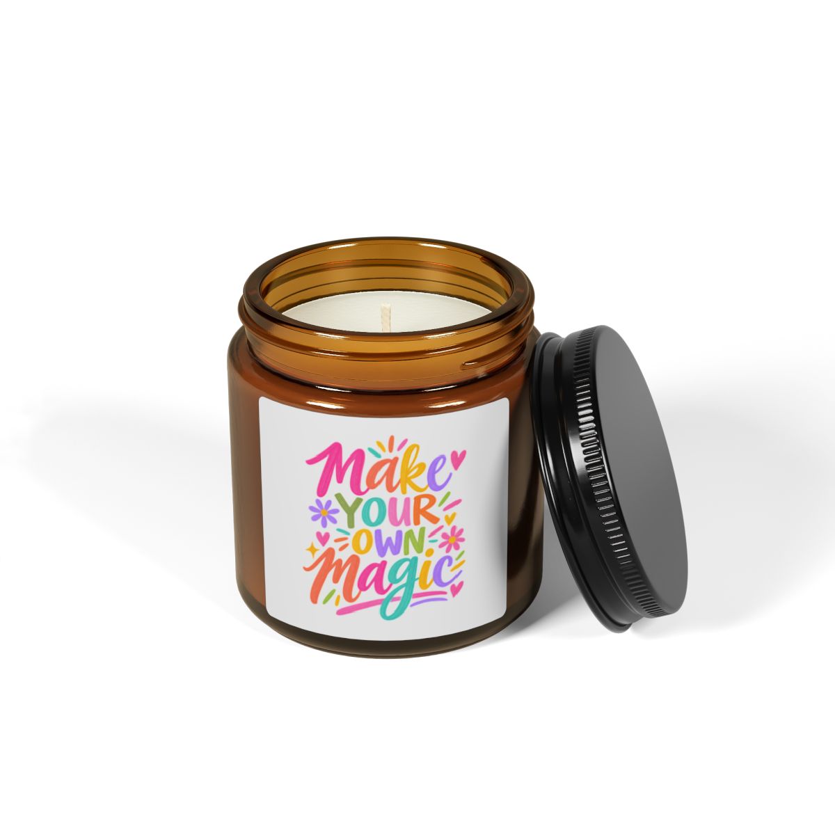 Make Your Own Magic soy candle in an amber glass jar with a bright hand-lettered label, shown open