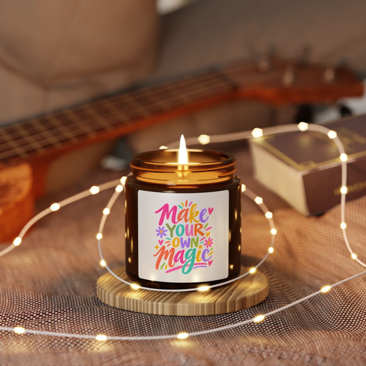 Make Your Own Magic soy candle in an amber glass jar with a bright hand-lettered label, in use