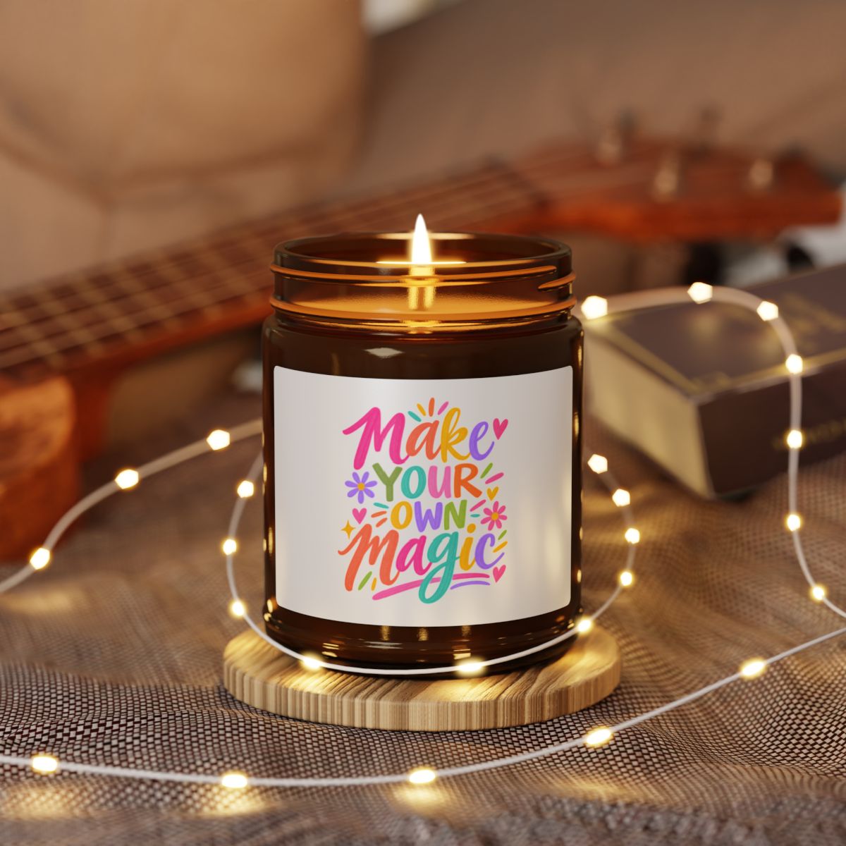 Make Your Own Magic soy candle in an amber glass jar with a bright hand-lettered label, shown open