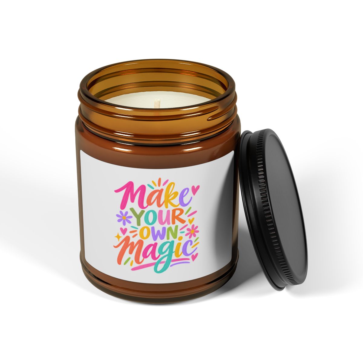 Make Your Own Magic soy candle in an amber glass jar with a bright hand-lettered label, front view