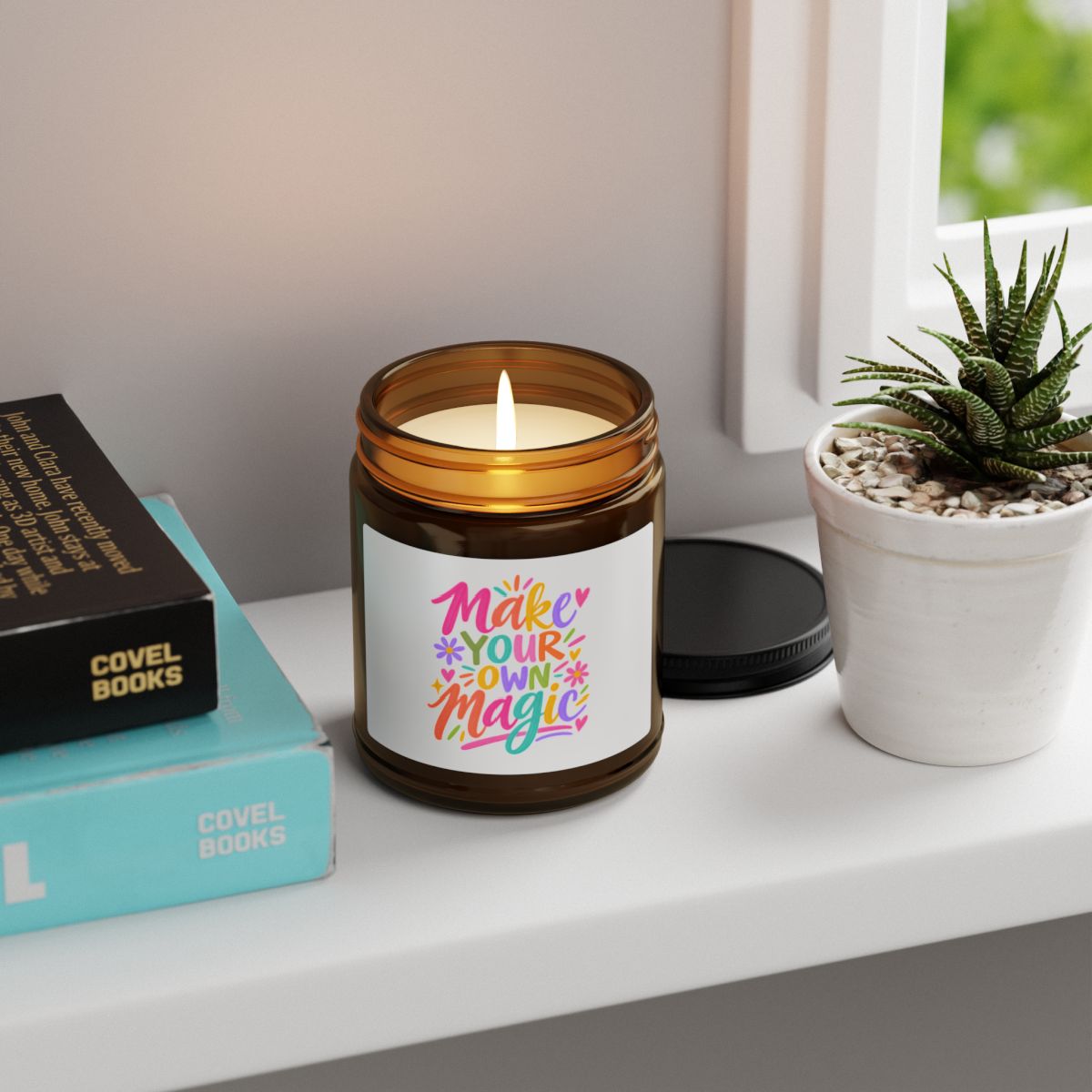 Make Your Own Magic soy candle in an amber glass jar with a bright hand-lettered label, in use