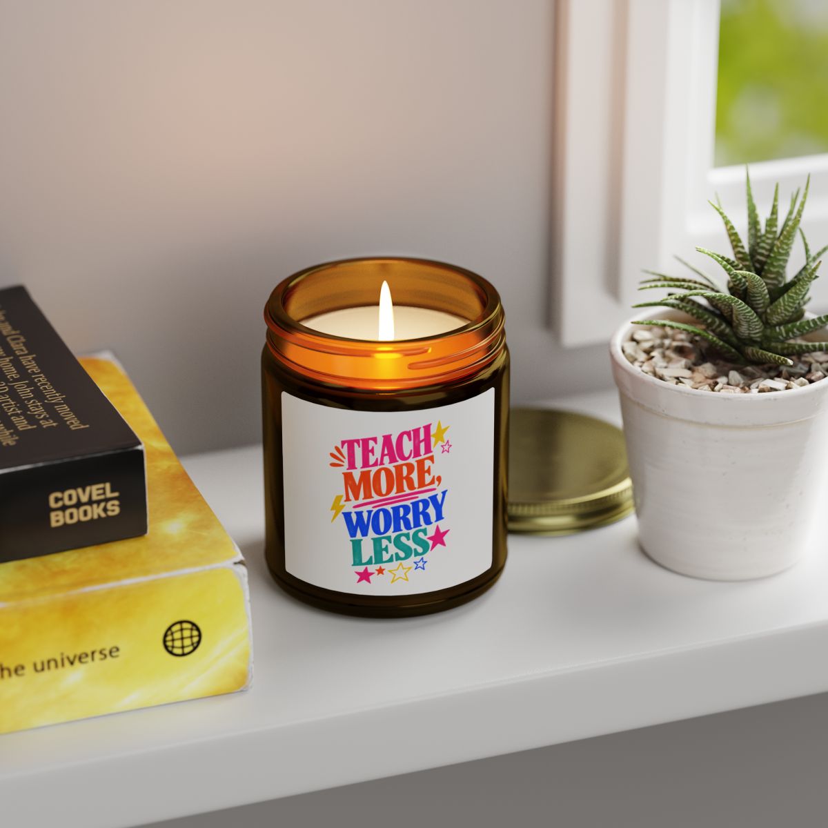Teach More, Worry Less scented candle in an amber glass jar, shown open